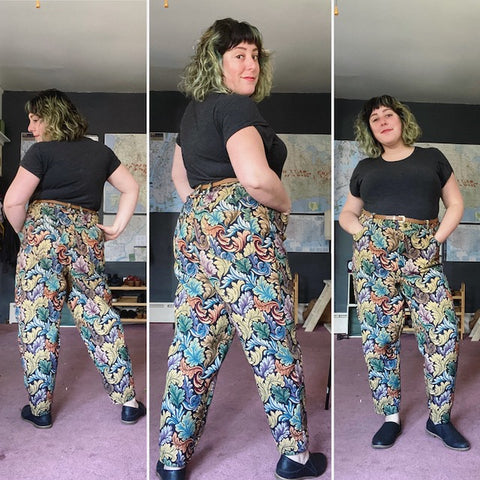 Three images of Ruby modeling a pair of high-waisted jeans made from a stiff floral tapestry fabric.