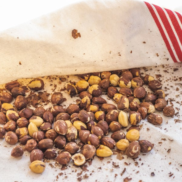 Toast hazelnuts and rub off skins in a cloth