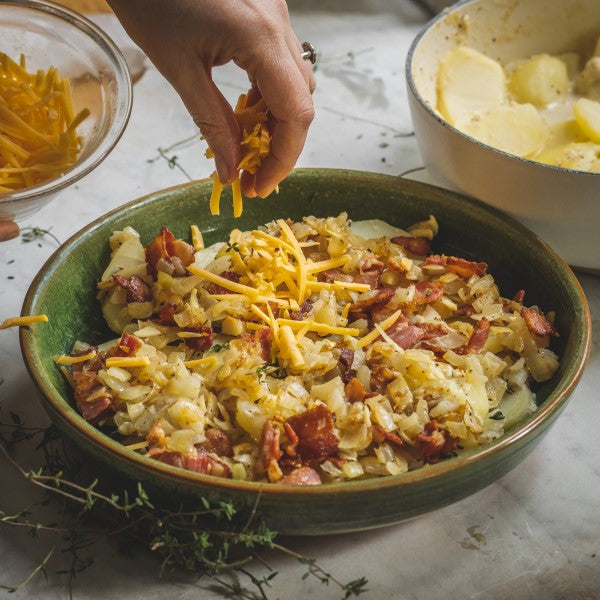 Sprinkle over bacon and cheese. Top with final potato layer, cover with pastry strips