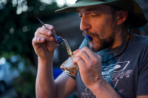 a man smoking wax using a dab rig