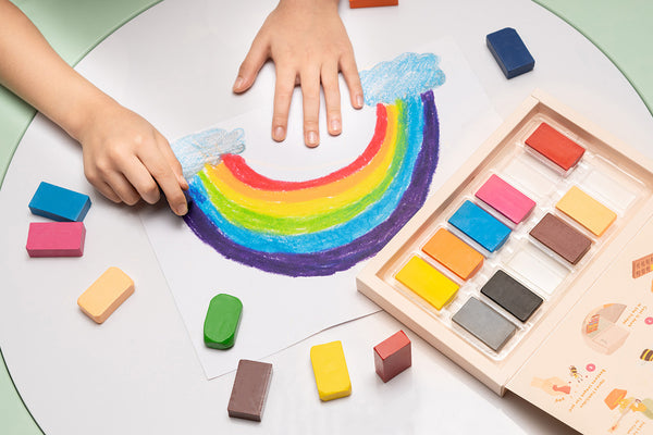 Drawing rainbow by crayon
