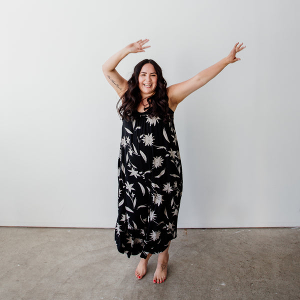 A woman dancing in a black dress