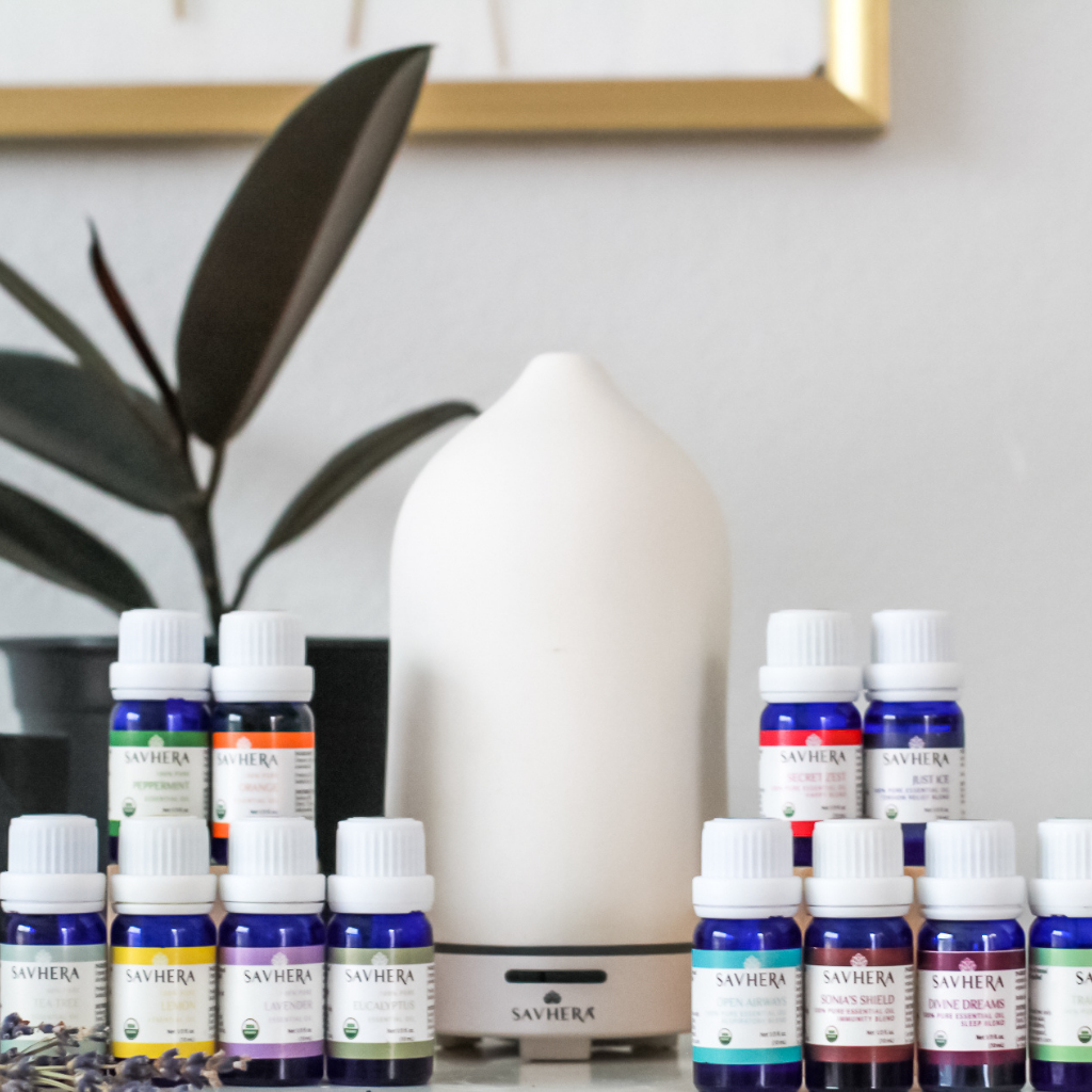 image of essential oils with an electric diffuser on a desk