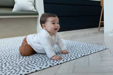 Baby on the Scout Totter + Tumble luxury playmat