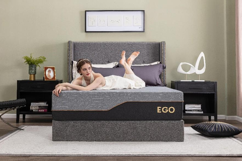 A beautiful lady lying on an EGO Black mattress.