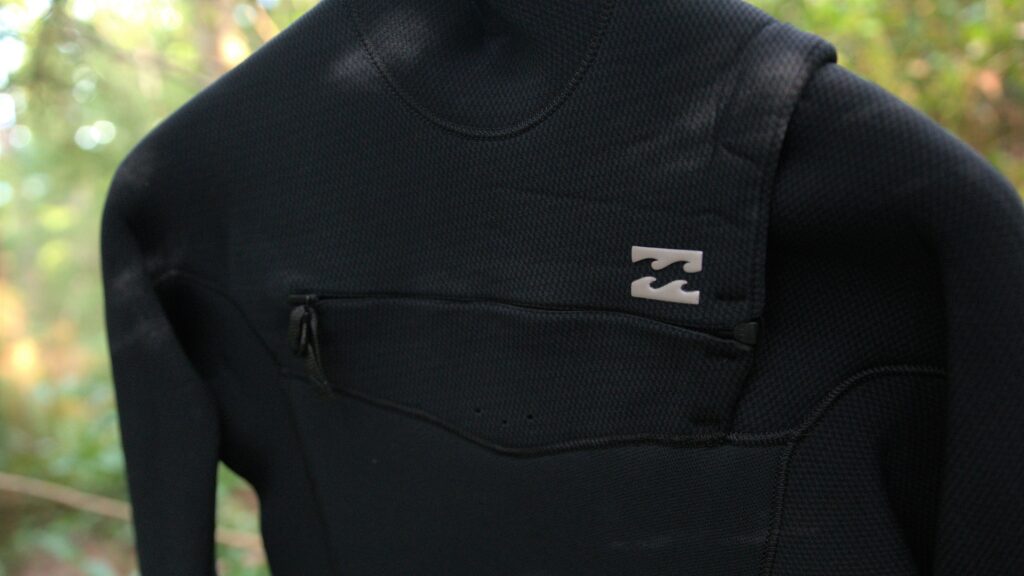 Billabong Revolution chest zip entry close up.