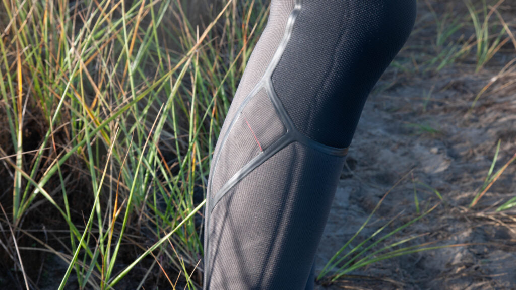 Close up of the key pocket on the right calf of the O'Neill Hyperfreak Fire wetsuit.
