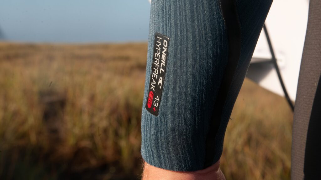Close up the thickness logo on the O'Neill Hyperfreak Fire wetsuit.