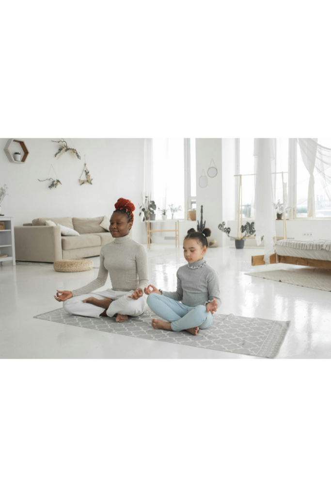 cute-ethnic-kid-with-mom-meditating-with-closed-eyes
