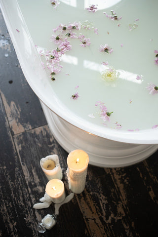bath with candles on the side