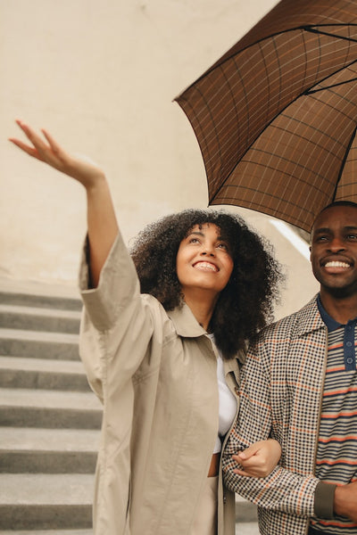 Photo by Polina Tankilevitch: https://www.pexels.com/photo/couple-with-brown-umbrella-7741627/