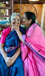 Kasturi Sivaraman (72) kissing the cheek of Laxmi Ammal (90)