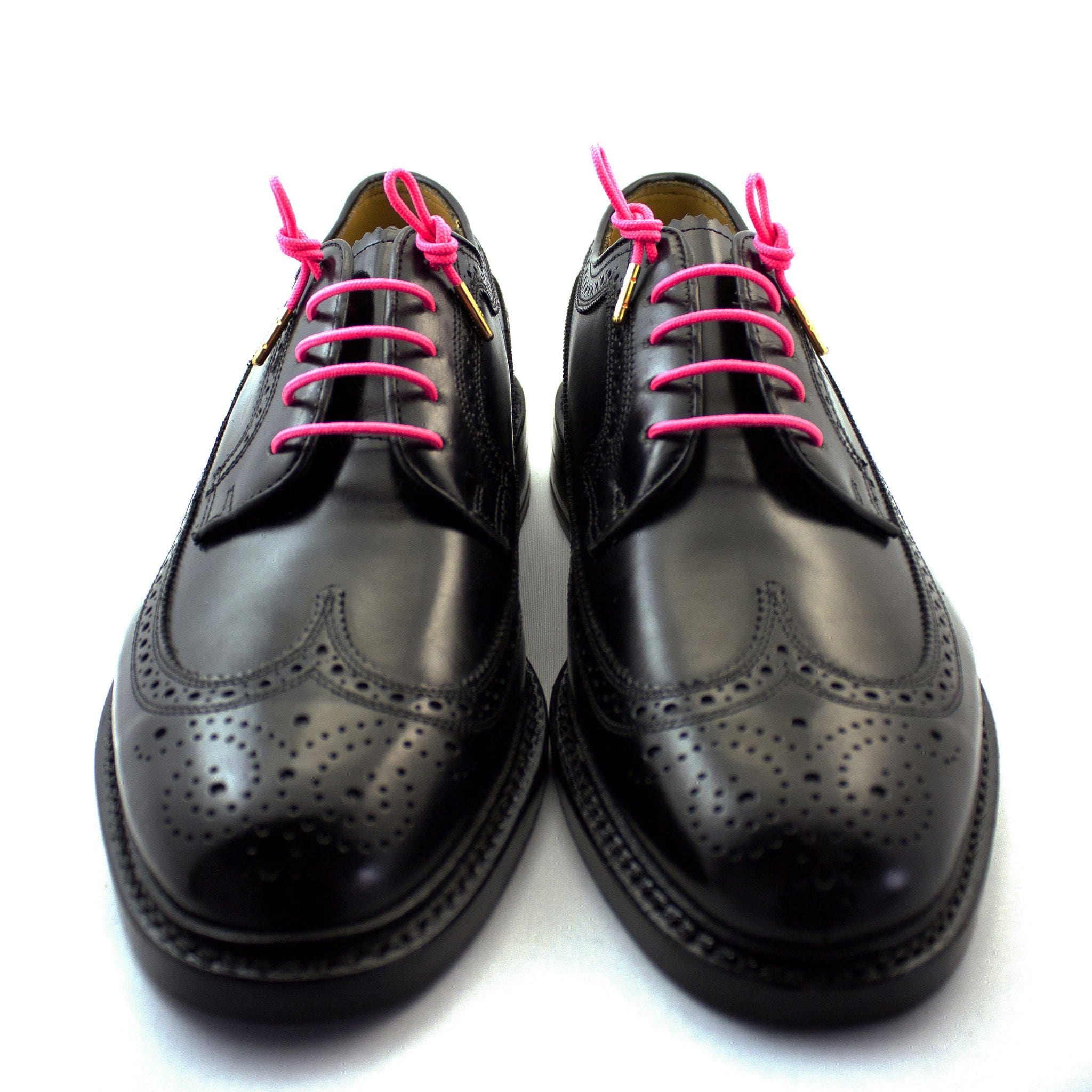 black shoes with pink laces