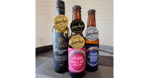 Bottles of Pommeau, Pink Lady and Heritage Blend cider pictured with recently won medals.