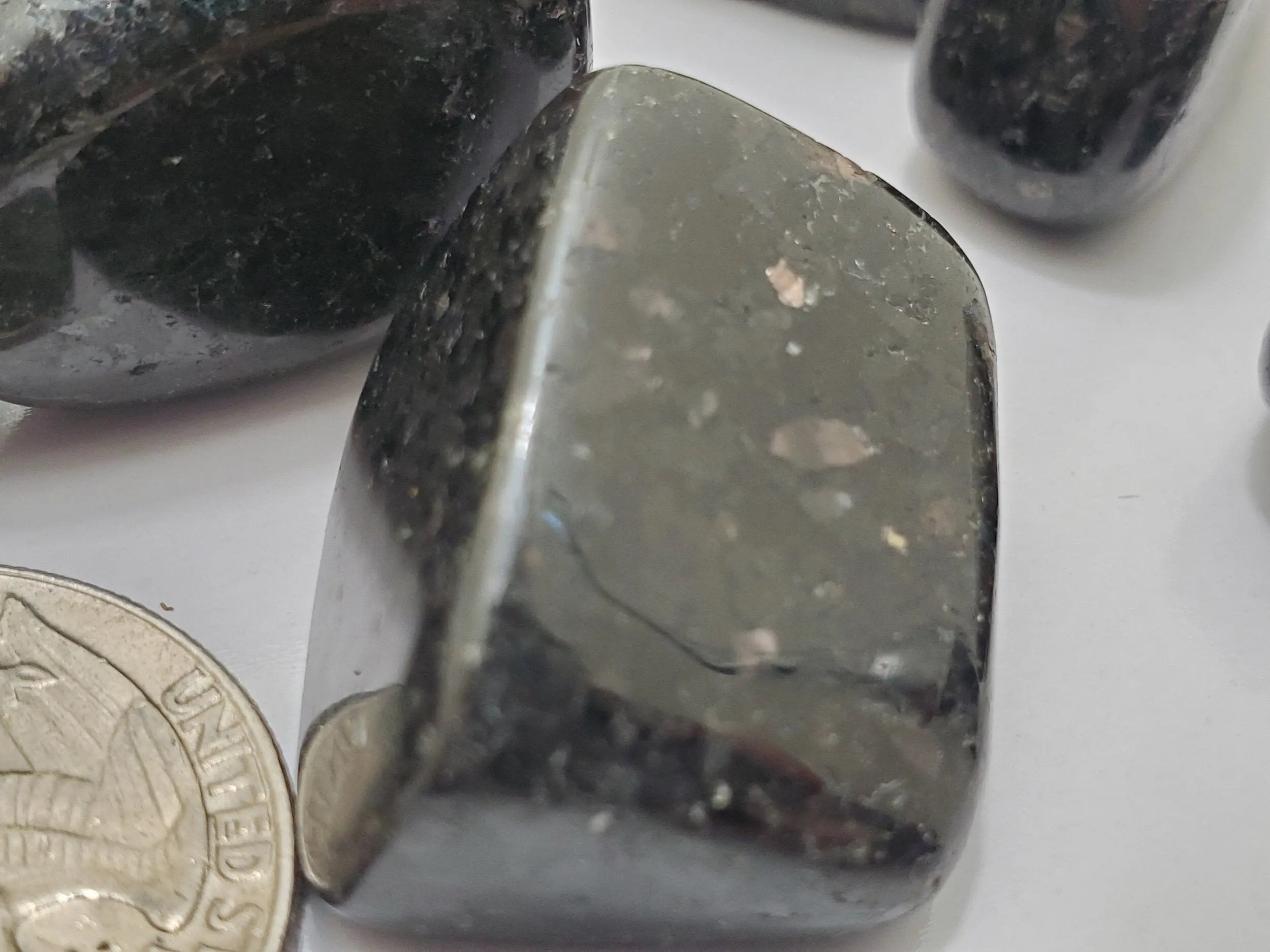 Nuummite tumbled stone