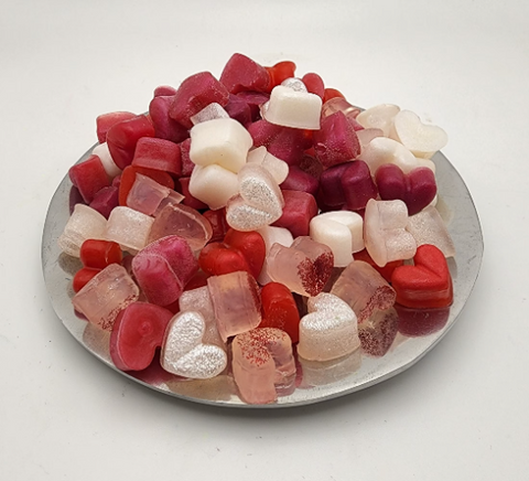 Tray of small heart-shaped soaps in reds, pinks, and whites