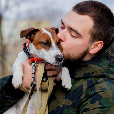 man comforting dog