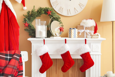 fireplace mantel with red stockings