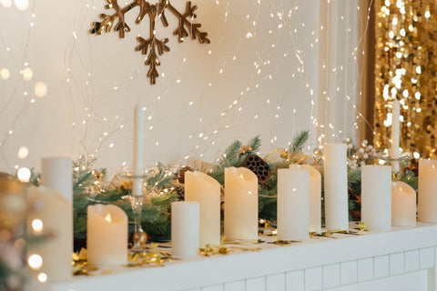 A beautiful studio decorated for holidays. Beautiful candles on the fireplace.