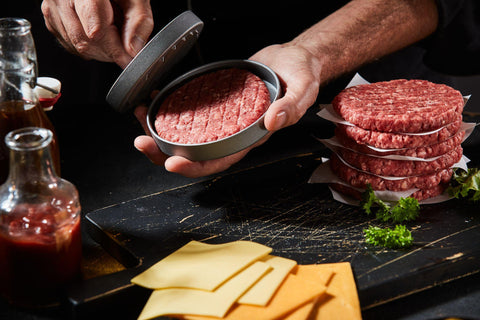 Chef preparing specialist homemade beef burger patties