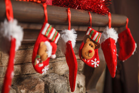 Christmas red stocking hanging from a mantel or fireplace