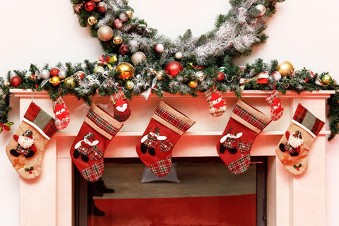 Christmas stockings on a fireplace mantel.
