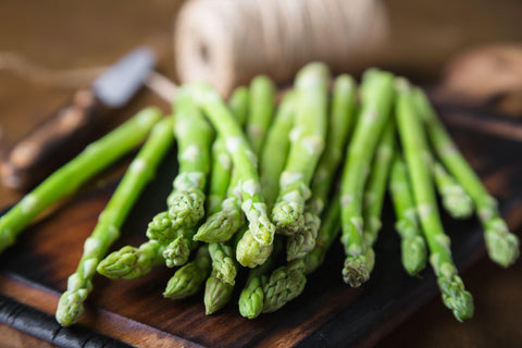 Fresh asparagus on a wooden table