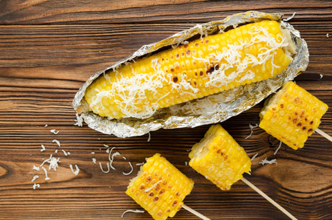 grilled corncob on wooden background