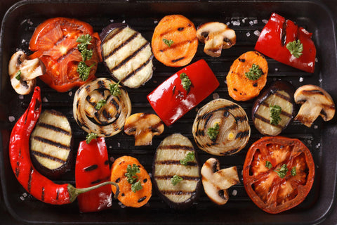 Background of grilled vegetables on a grill close up.