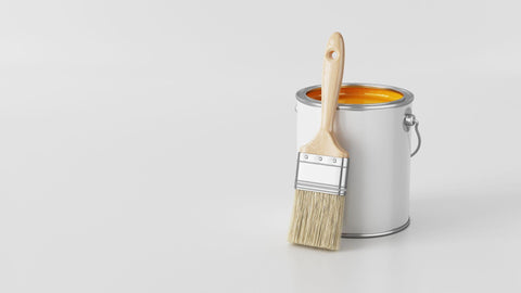 Paint Can with orange paint and Paintbrush on white background.