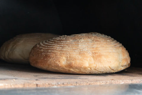 Sourdough bread in a wood fired pizza oven