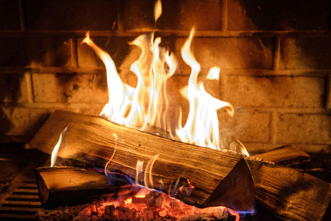 Wood burning in a fireplace.