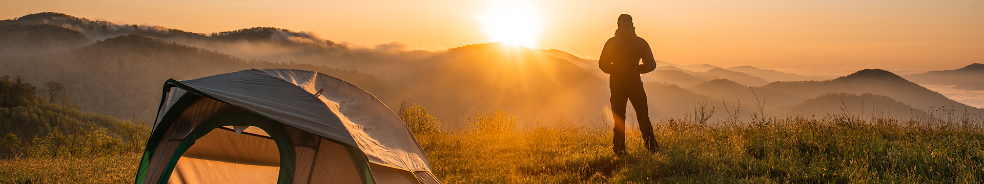 Camper watching sunset