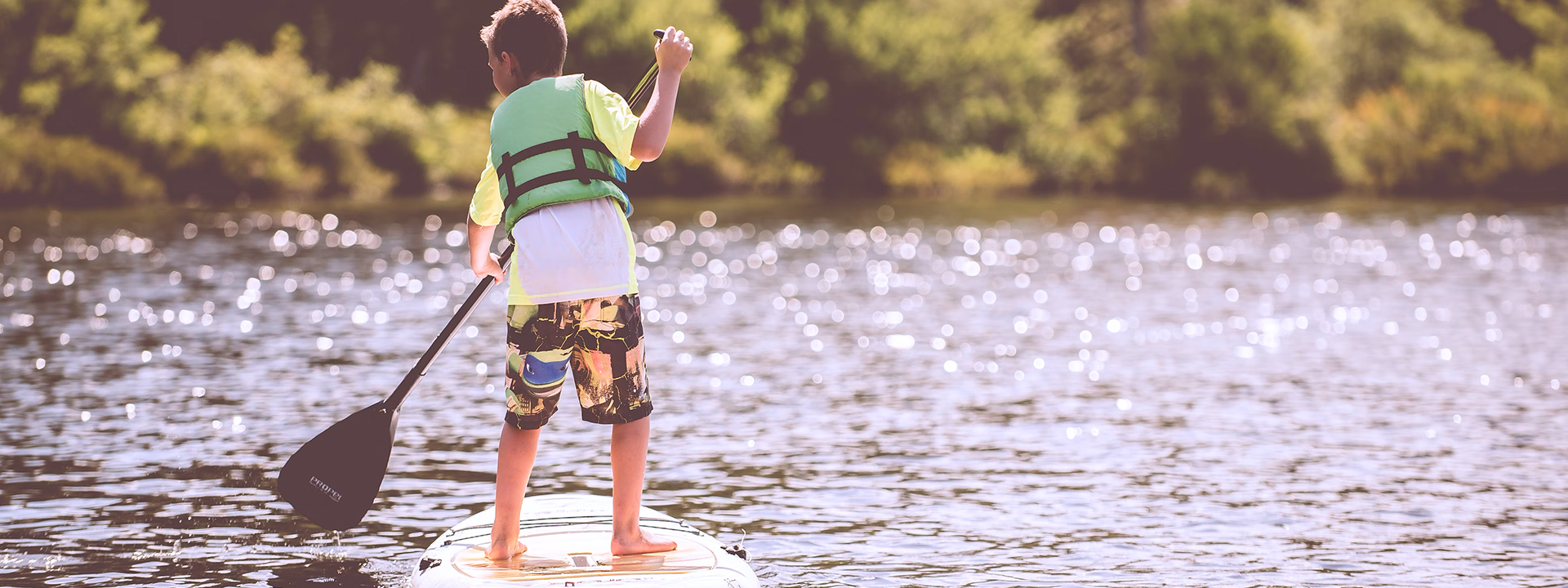 Boy on Stand Up Paddle Board