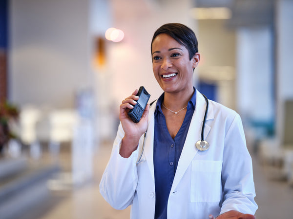 Image of a doctor using the Olympus DS-9100 dictation recorder