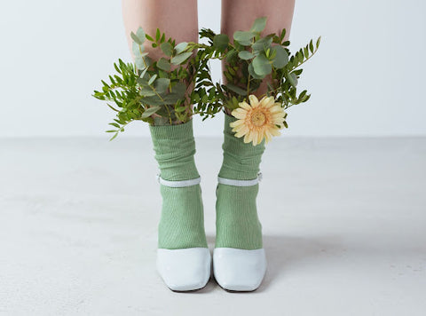 White womens shoes with attached flowers