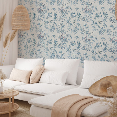 Bamboo Chinoiserie peel and stick wallpaper in a living room behind a white couch