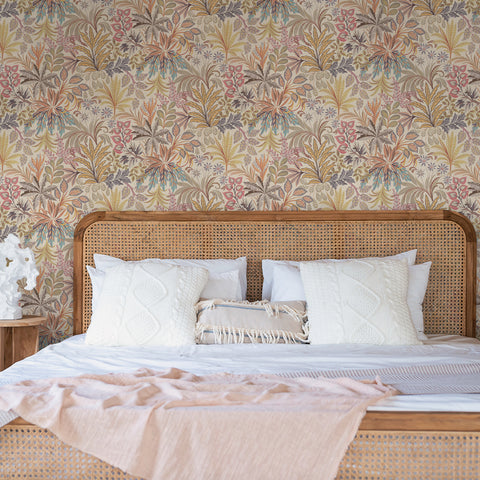 Neutral floral peel and stick wallpaper in a bedroom of textured walls.