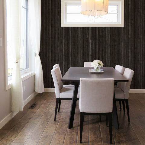 Textured grass cloth wallpaper on a focal wall of a modern dining room