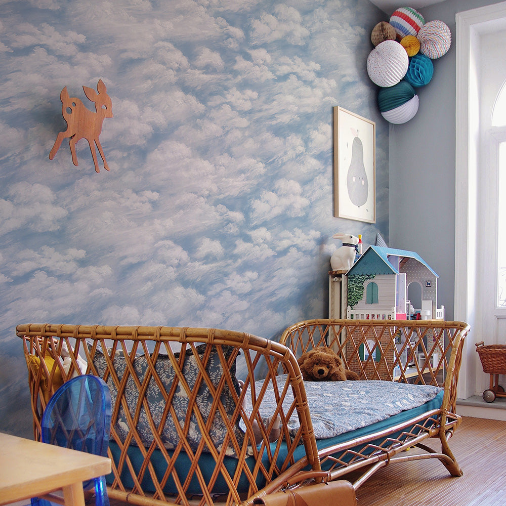 Tempaper's Clouds Peel And Stick Wall Mural in light blue.