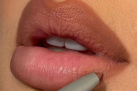 Stixx M November 5, 2022·1 min read   1 / 2 The “Oval-Lining” Trend Is TikTok’s Money Saving Hack for Fuller Lips For those wanting to know why they don't have full lips, the tea is you're either born with them, or you can buy them — that's it, that's the solution. However, a new trend on TikTok is making coming by a plump pout even more realistic and it involves something you already have in your makeup caboodle: lip liner.  Meet the affordable and lip filler-free hack from TikTok, "oval-lining." The hack is the key to getting the sought-after rounded shape on your top lip, giving an appearance of instantly fuller puckers. All you have to do is redraw your lips in the form of a circle, and you're done. To completely ace the oval-liner hack, ensure that the lip liner matches the natural shade of your mouth. When applying the liner, make minor marks on the cupid's bow and the middle of the lower lip, then draw a circle directly in the center of the lips, leaving the sides out for blotting.  Hopefully, this noninvasive trick will save you the pain of lip filler injections and give you the desired pouty pucker. Take a look closer at the oval-lip liner tutorials below.