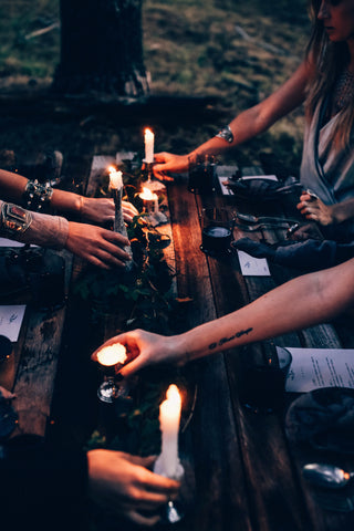 rituals and prayers with candles holding hands