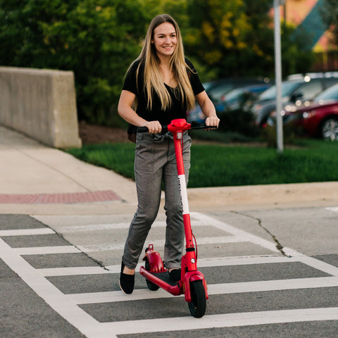 Women riding GOTRAX Red Apex Foldable Electric Scooter for Adults