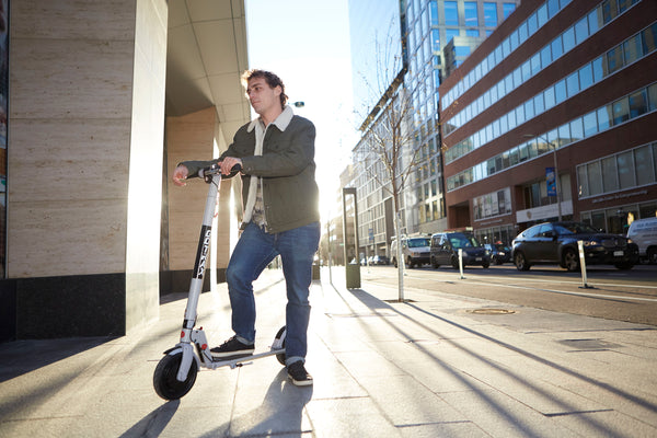 Man with XR Ultra Foldable Electric Scooter for Adults