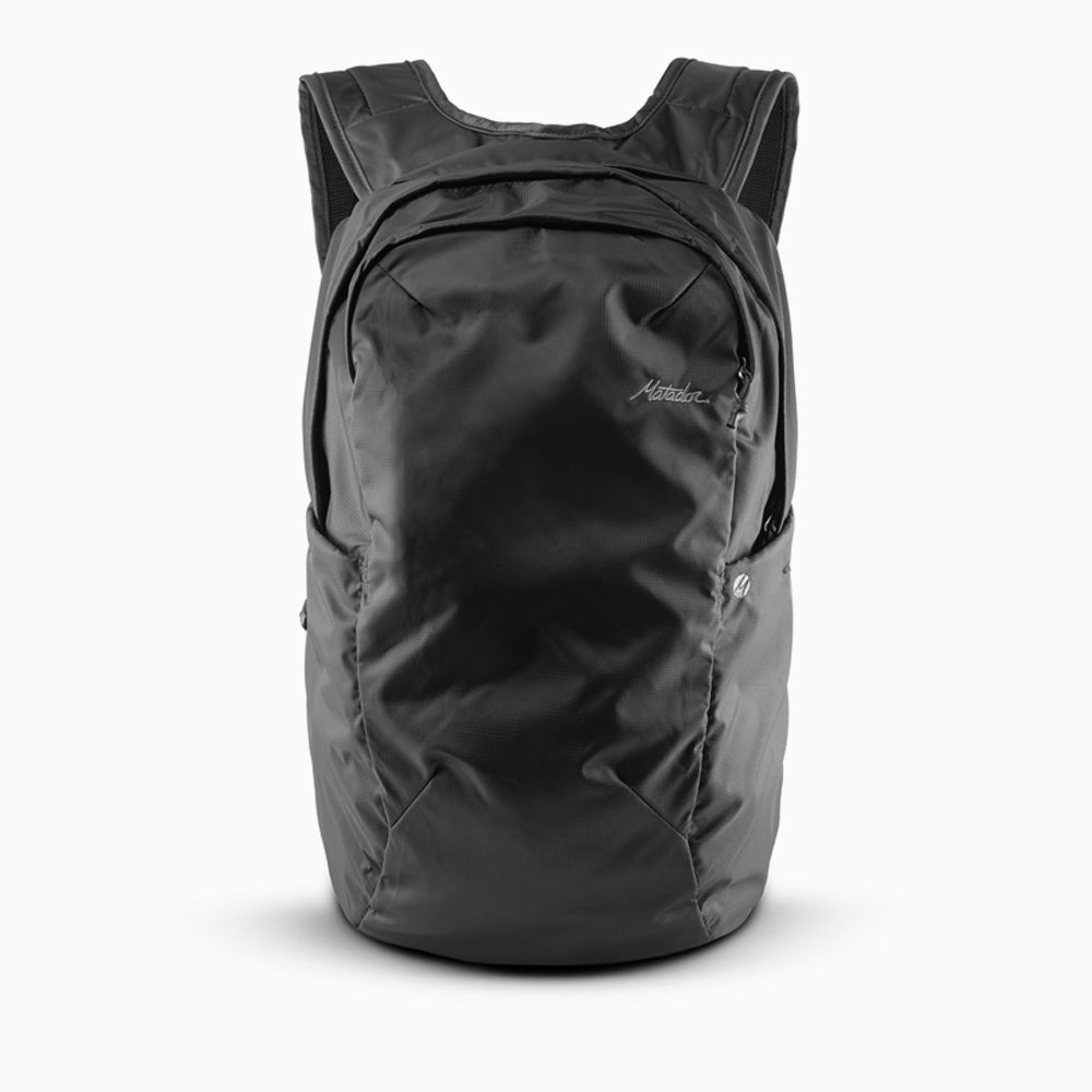 Black backpack on white background