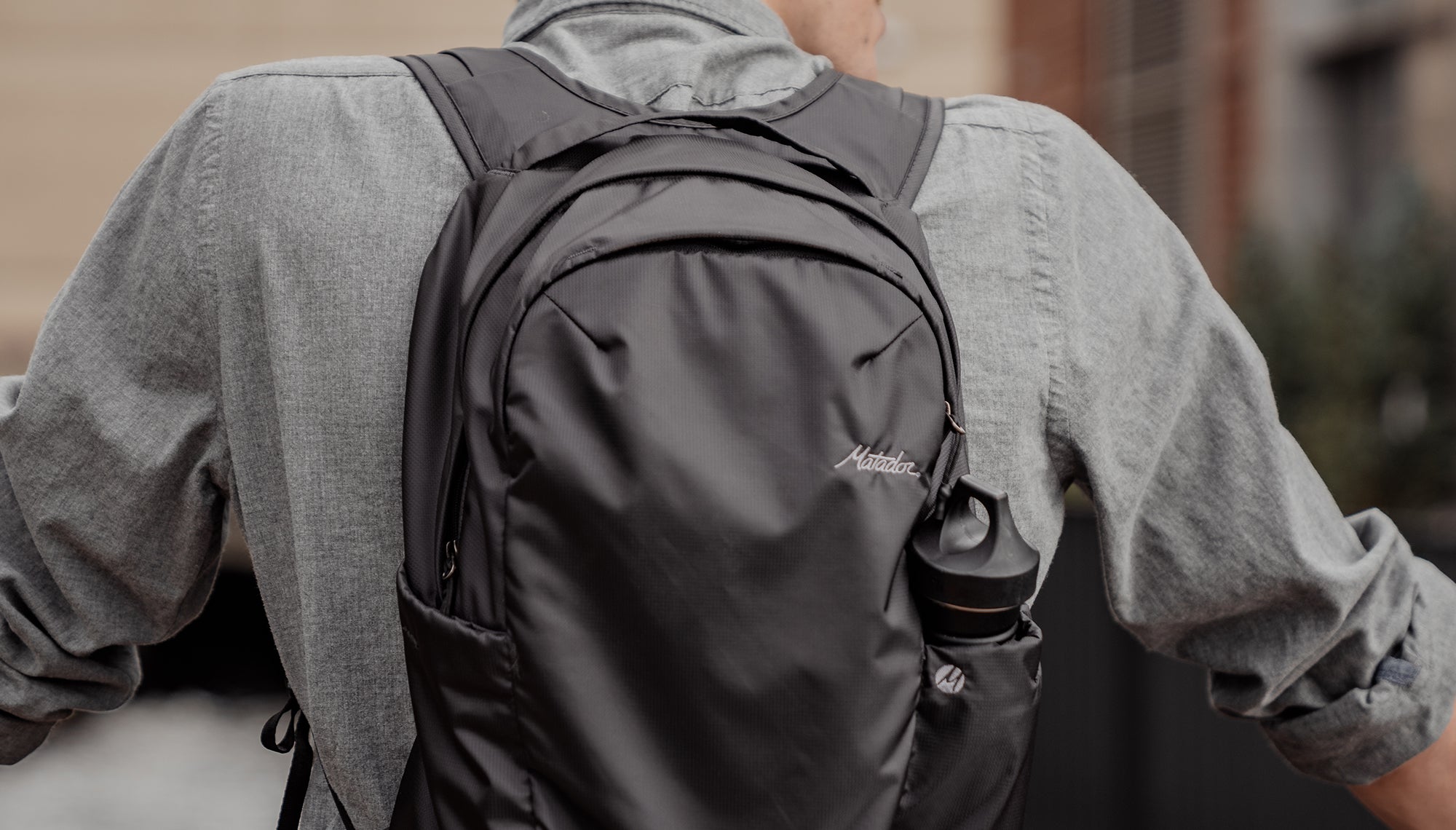 Close up view of backpack on man's back