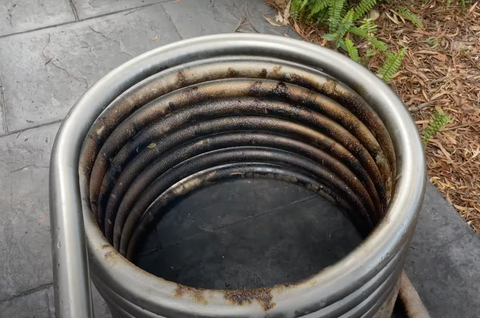 Hot tub coil being cleaned