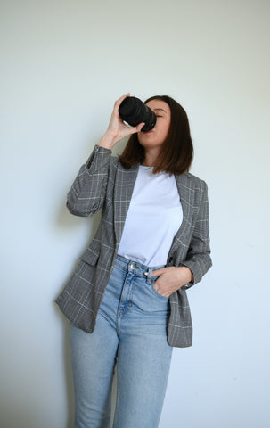 Nibbed woman drinking mug cacao