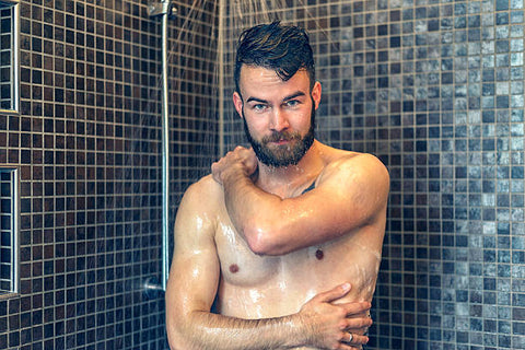 man having a bath with anti bacterial soap