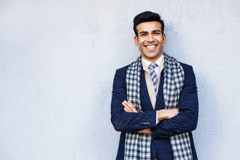 man in suit and beautiful necktie smiling